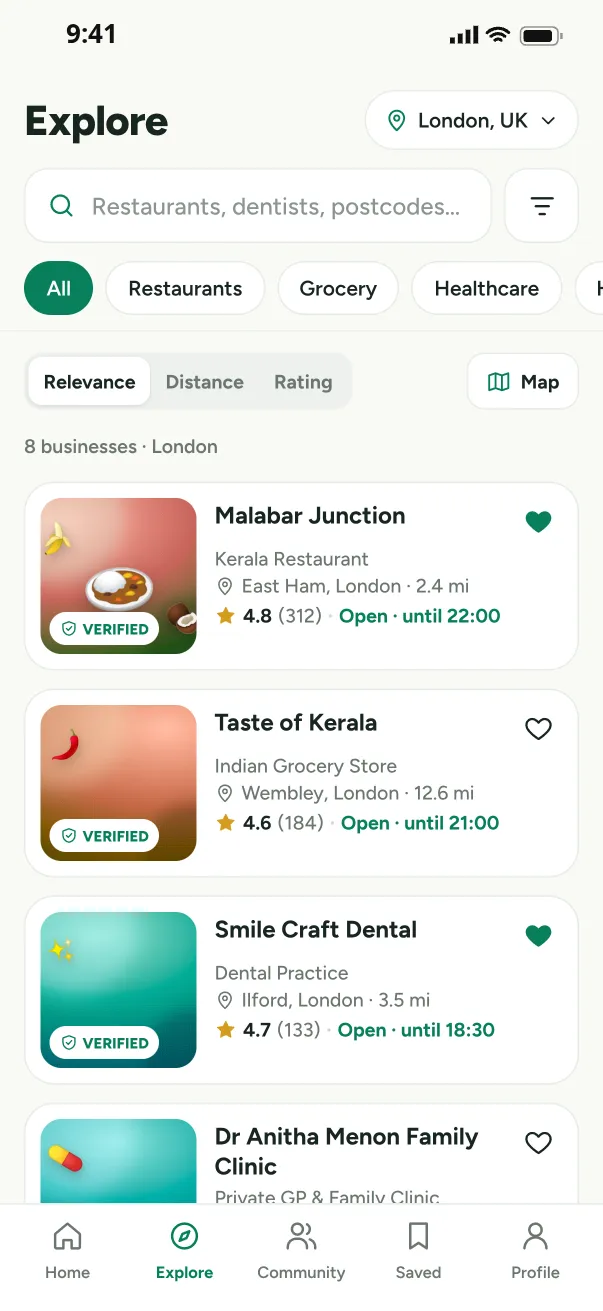 Explore screen listing verified Malayali businesses with distance and open status